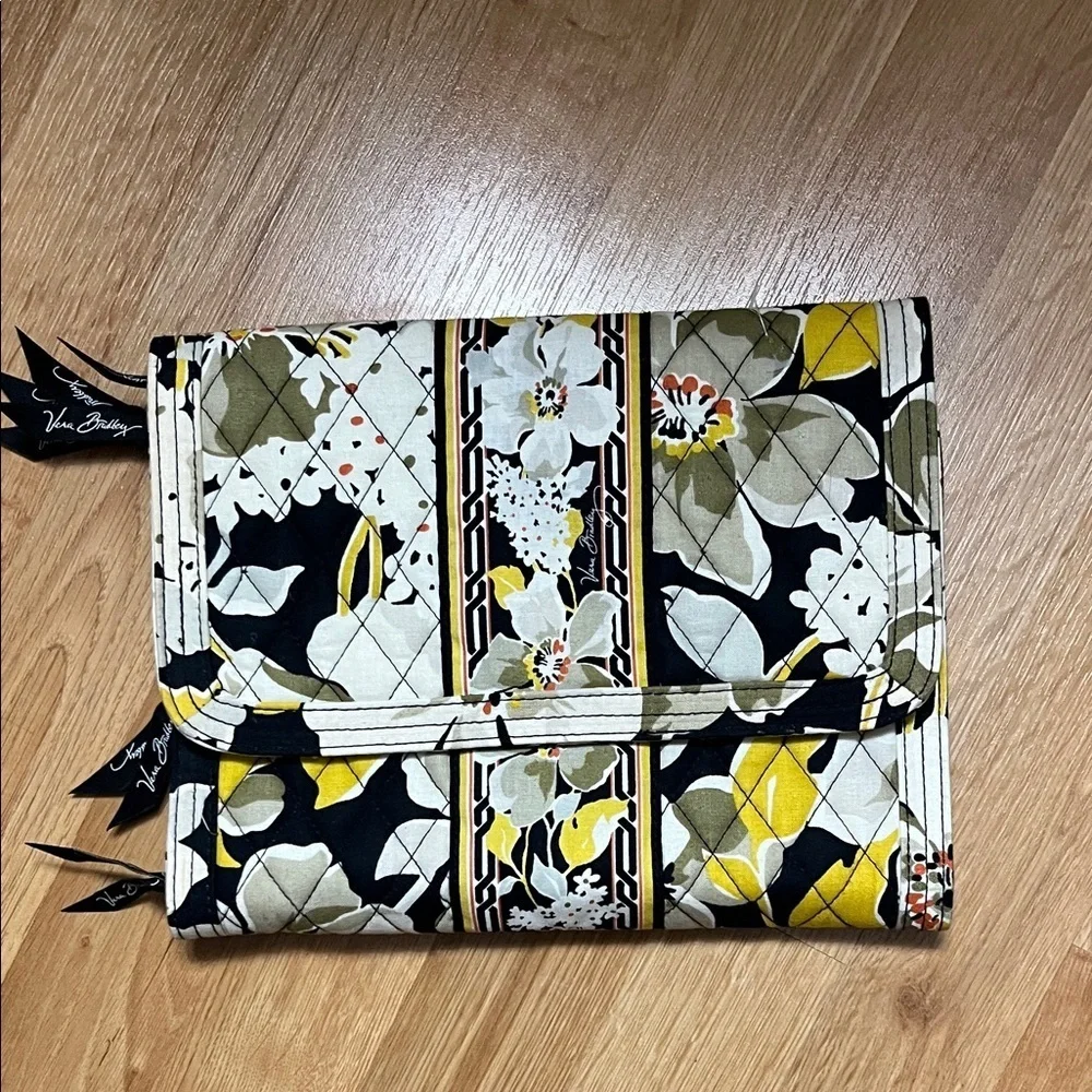 Vera Bradley travel case. Clear pouches inside for storage.